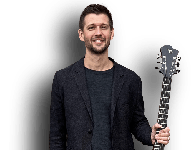 Brent holding guitar