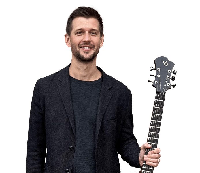 Brent holding guitar